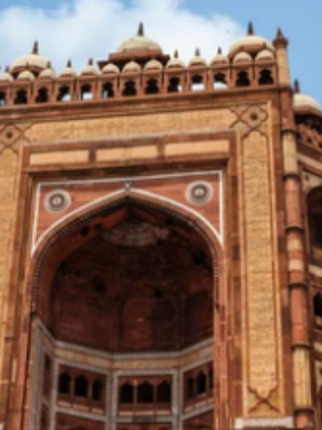 Why did Akbar build Fatehpur Sikri in that location?